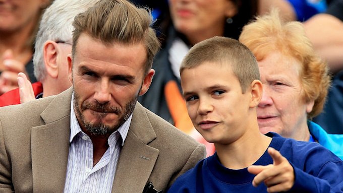 Romeo Beckham gets hair transformation during day out with dad David ...