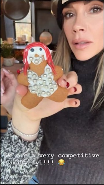 Harper Seven holding gingerbread man to camera