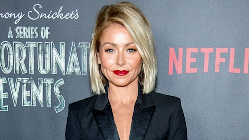 Kelly Ripa looks incredibly toned during workout inside her beautiful bedroom