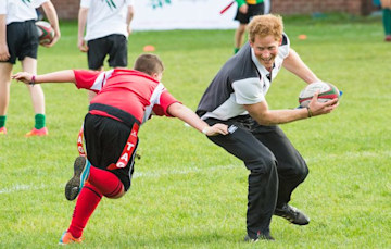 Prince Harry playing rugby