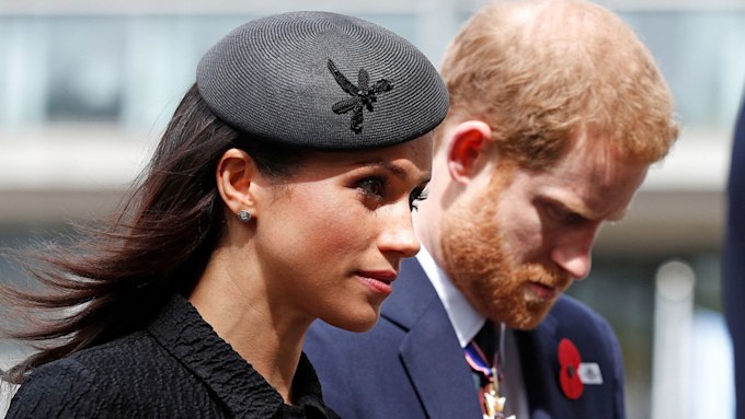 Meghan Markle and Prince Harry looking serious