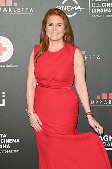Sarah Ferguson smiling in a red dress