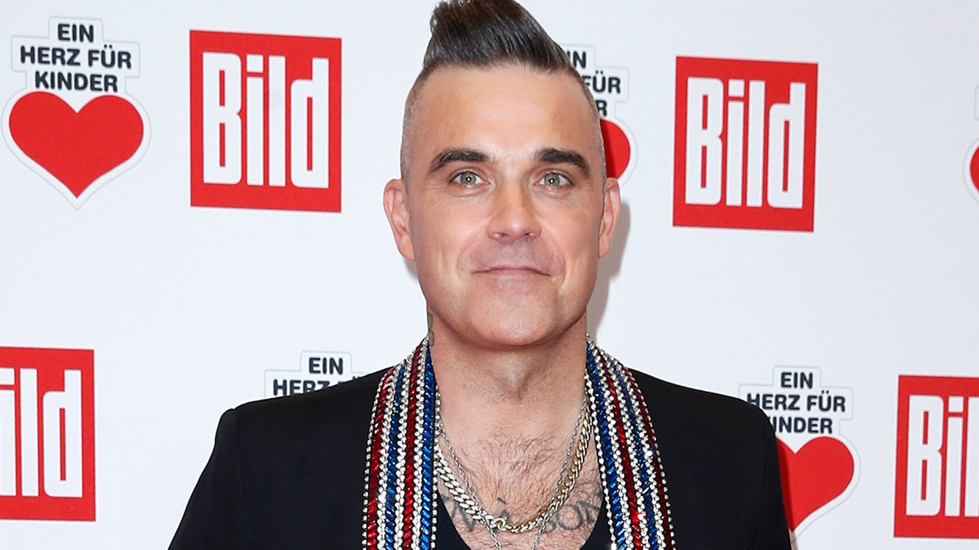 Robbie Williams gives son Charlie a makeover and you won