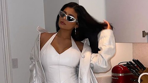 Kylie Jenner showcases baby bump in white leather mini dress - and fans are saying the same thing