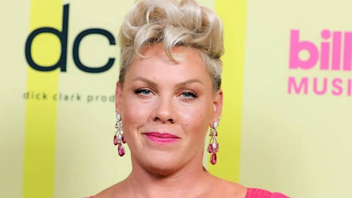 Pink sparks debate with photo of her two children at their family home