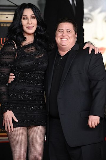 Cher standing with Chaz Bono