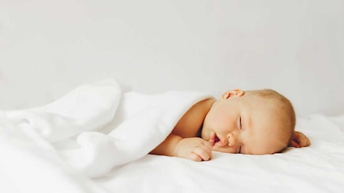 When do babies start sleeping through the night? Expert advice tired new parents need to know