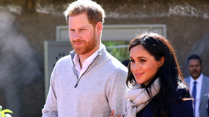 meghan markle smiling with prince harry 