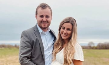 Jed and Katey Duggar pose arm in arm in a corn field