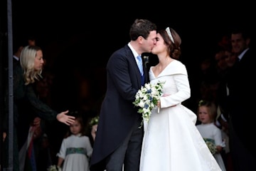 Princess Eugenie kissing her husband Jack on their wedding day 