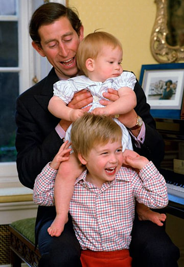 Prince Charles with young sons smiles