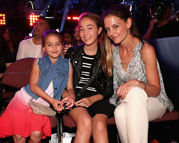 Katie Holmes and daughter Suri smile at awards ceremony