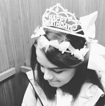 Suri Cruise wears a birthday tiara