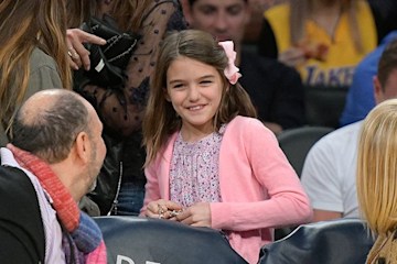 Suri Cruise wears pink at sports game