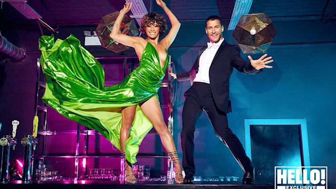 Gorka Marquez poses in a suit with his Strictly Come Dancing co-star Karen Hauer