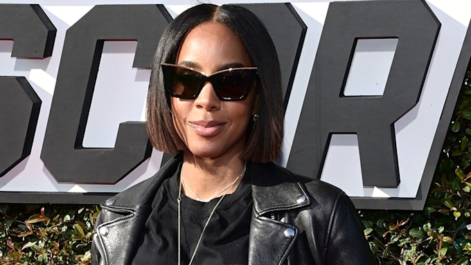 Kelly Rowland in sunglasses and leather jacket