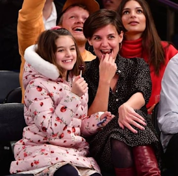 Katie Holmes with daughter Suri at a basketball game