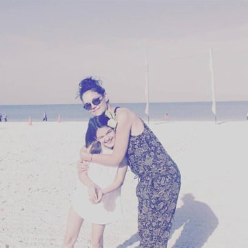 Katie Holmes hugs daughter Suri Cruise on the beach