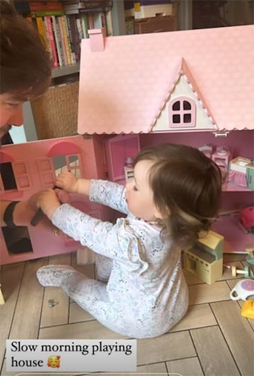 need this moment with you Young girl playing with dolls