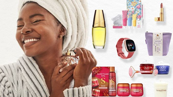 Model holding perfume surrounded by products from Boots