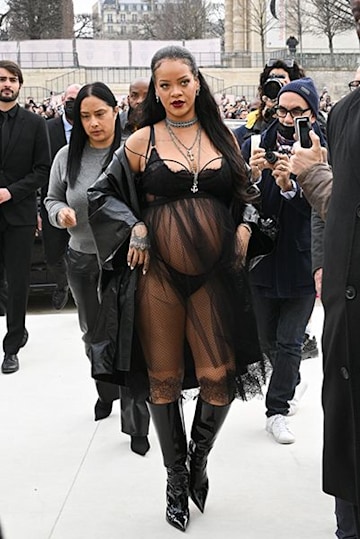 Rihanna wearing black lace Dior outfit at Paris Fashion Week 