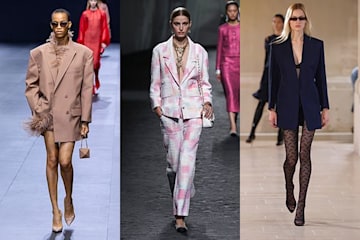 Three models wearing tailoring on the runway 