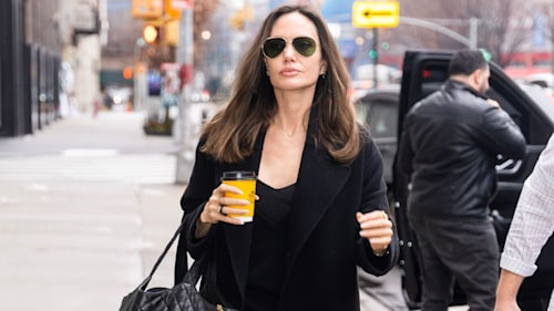 Angelina Jolie just perfected the coffee run in a 90s throwback slip dress