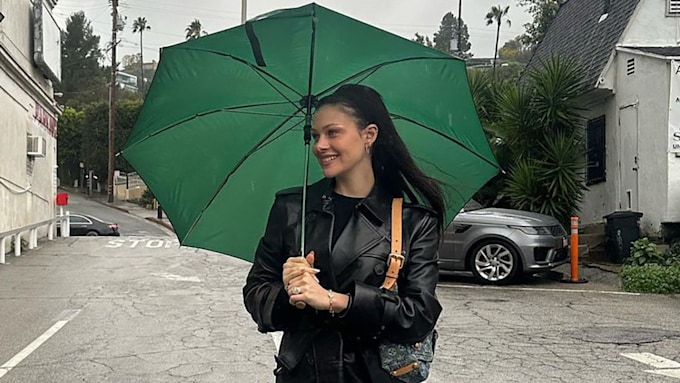 Nicola Peltz Poses With Green Umbrella