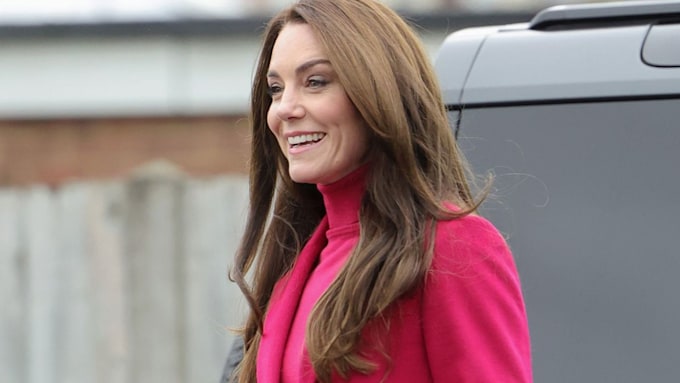 Kate Middleton wore a hot pink jumper and affordable Marks & Spencer coat to visit the Windsor Foodshare