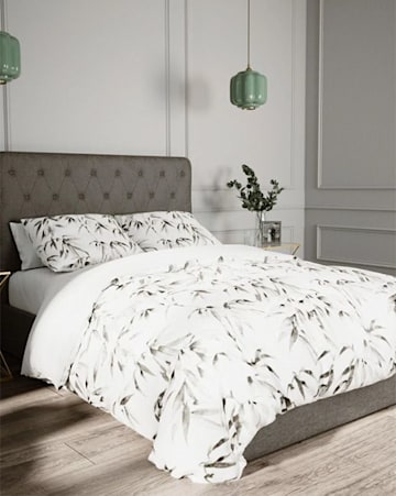 grey upholstered double bed 