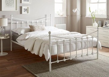 double bed with white metal frame 