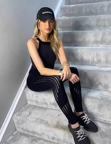 Jack Grealish's girlfriend Sasha Attwood sitting on stairs