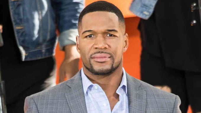 Michael Strahan wearing a suit