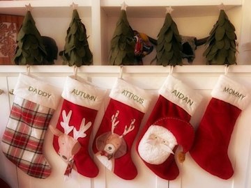 Personalized stockings hanging on dresser
