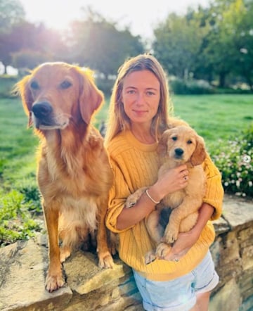 james' wife cuddling dogs