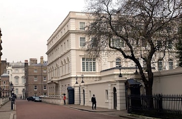 the exterior of a white walled palace in london