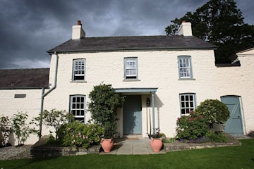 a traditional welsh white stone cottage 