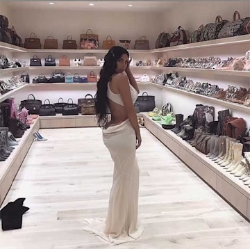 Kim Kardashian poses inside a huge walk-in closet