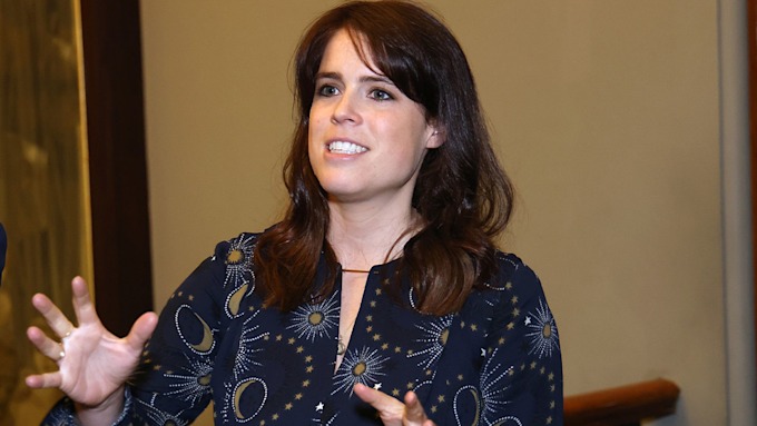 princess eugenie talking in blue dress