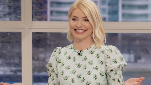 Holly Willoughby dons ripped jeans to plant flowers in her dreamy garden