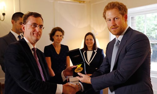 Prince Harry presents US soldier's Invictus Games medal to the medics who saved her life
