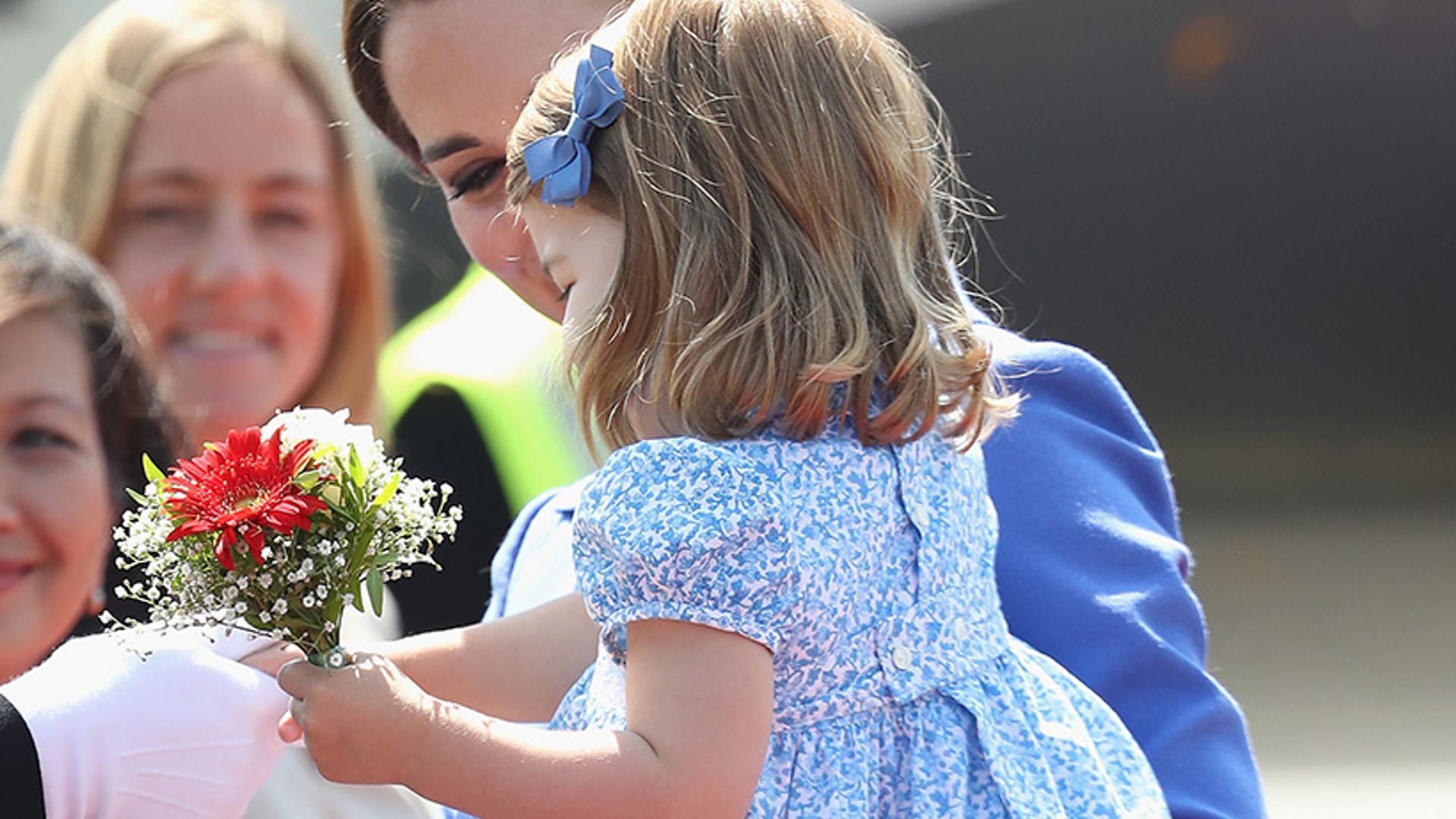 Royal Tour 2017 Princess Charlotte takes her royal duties seriously with diplomatic handshake