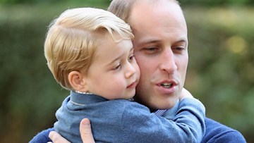 Prince William hugging George