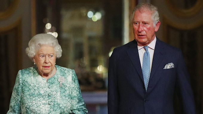 the queen and prince charles looking sombre