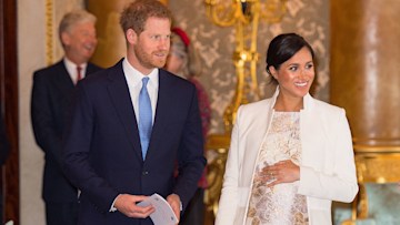 prince harry and pregnant wife meghan markle at palace
