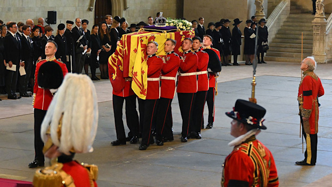 Member of the royal family appears to faint as the Queen's coffin ...