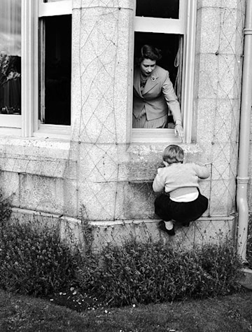 TrivDaily - King Charles chooses incredibly special childhood photo to pay tribute to his late mother The Queen 55 prince-charles-climbning-balmoral-window