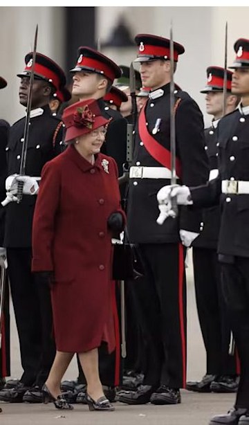 Prince William grinned as the Queen passed by at her military graduation