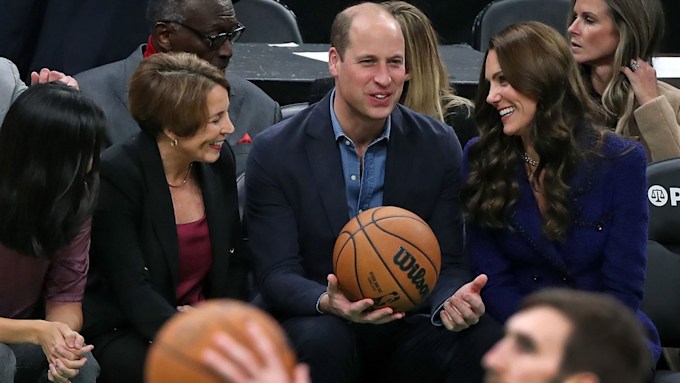 prince william holds a basketball game while smiling kate middleton looks on courtside in boston