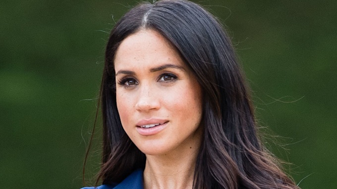 A close up photo of Meghan Markle taken during a royal engagement